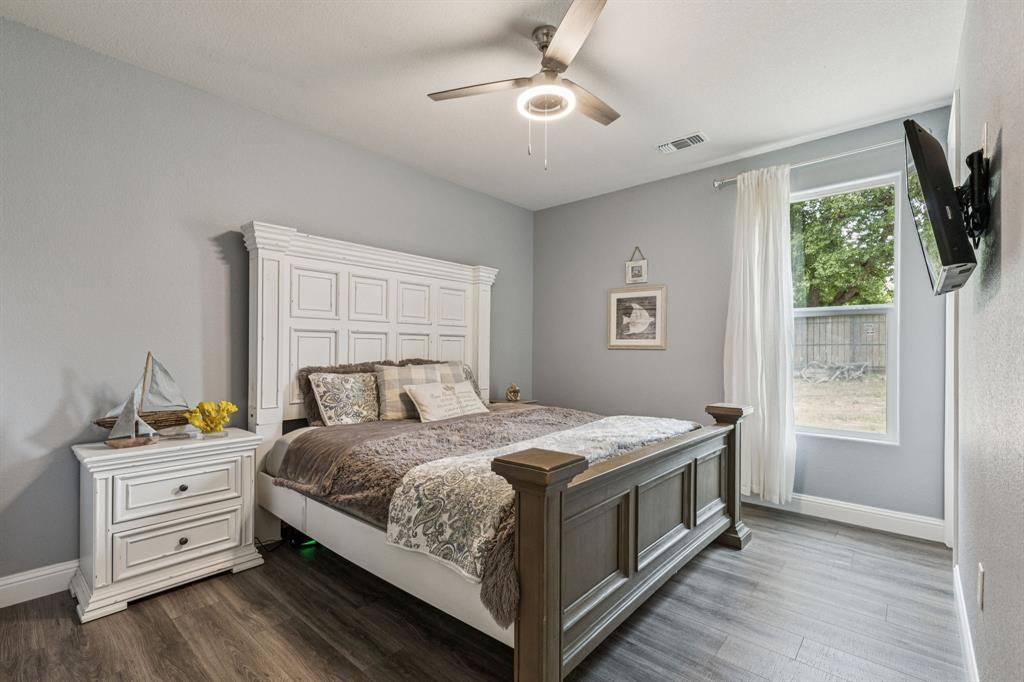 6467 Asher Road Alvarado, TX 76009 - Photo 31 of 40 a bedroom with a bed and a window