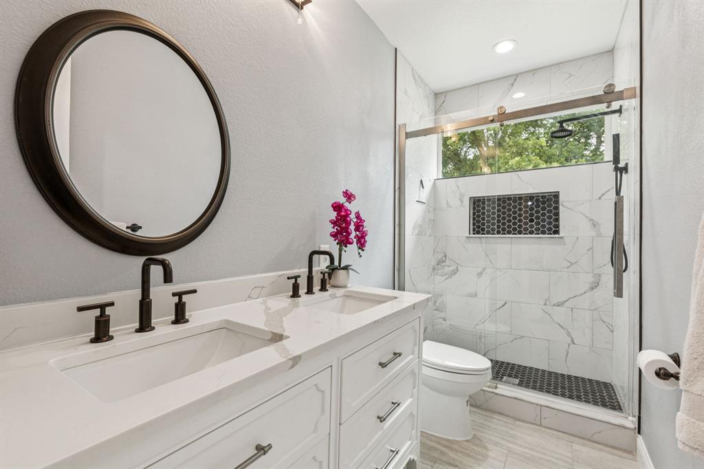 6467 Asher Road Alvarado, TX 76009 - Photo 34 of 40 a bathroom with a sink a toilet and a mirror