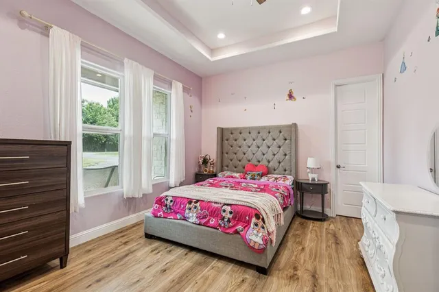 a bedroom with a bed and a dresser