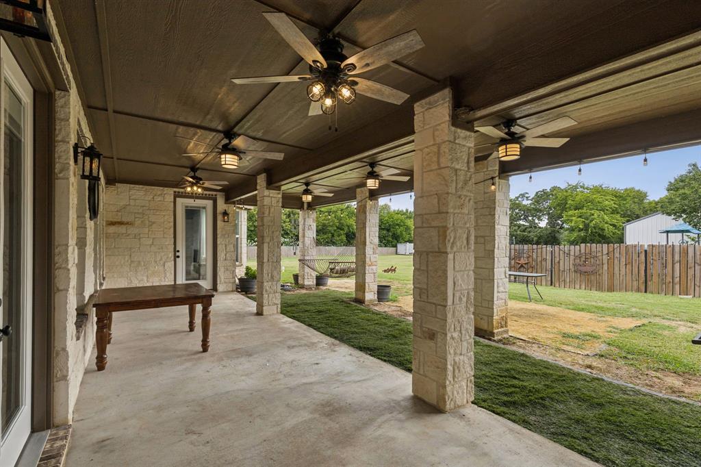 6467 Asher Road Alvarado, TX 76009 - Photo 37 of 40 a view of a porch with furniture and a yard