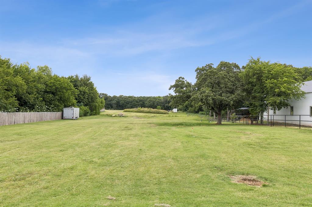 6467 Asher Road Alvarado, TX 76009 - Photo 6 of 40 a view of a field with trees in the background