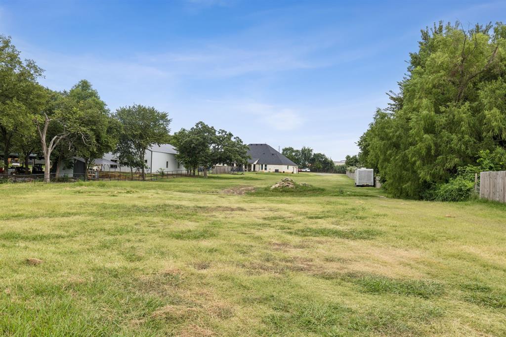 6467 Asher Road Alvarado, TX 76009 - Photo 9 of 40 a view of a water fountain and a big yard