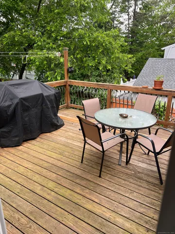a view of balcony with wooden floor