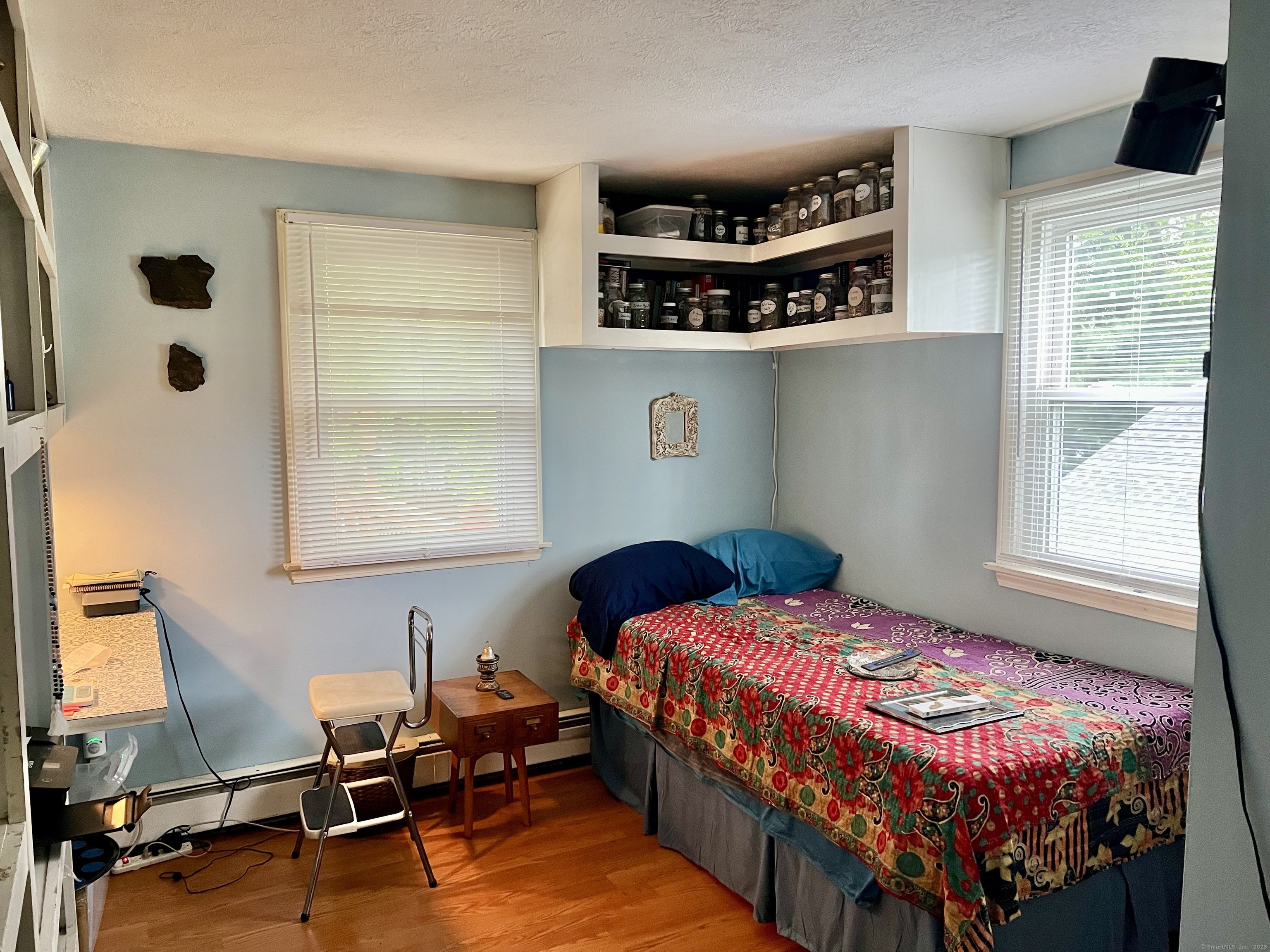 61 Litchfield Road Farmington, CT 06085 - Photo 16 of 27 a bedroom with a bed and a window