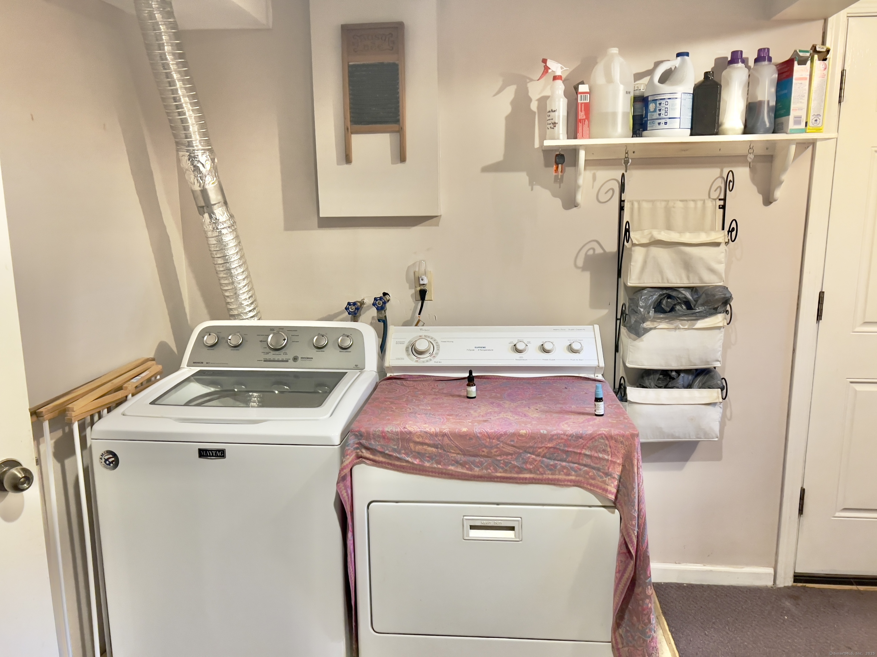 61 Litchfield Road Farmington, CT 06085 - Photo 19 of 27 a utility room with dryer and washer