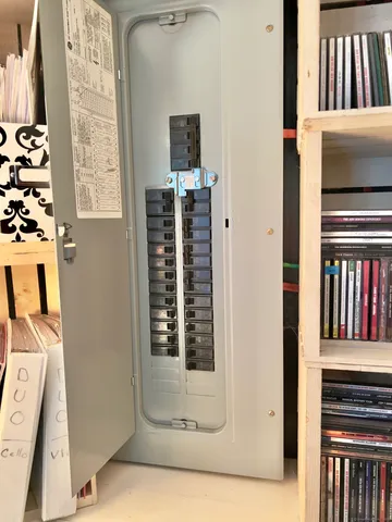 a living room with furniture a flat screen tv and a table