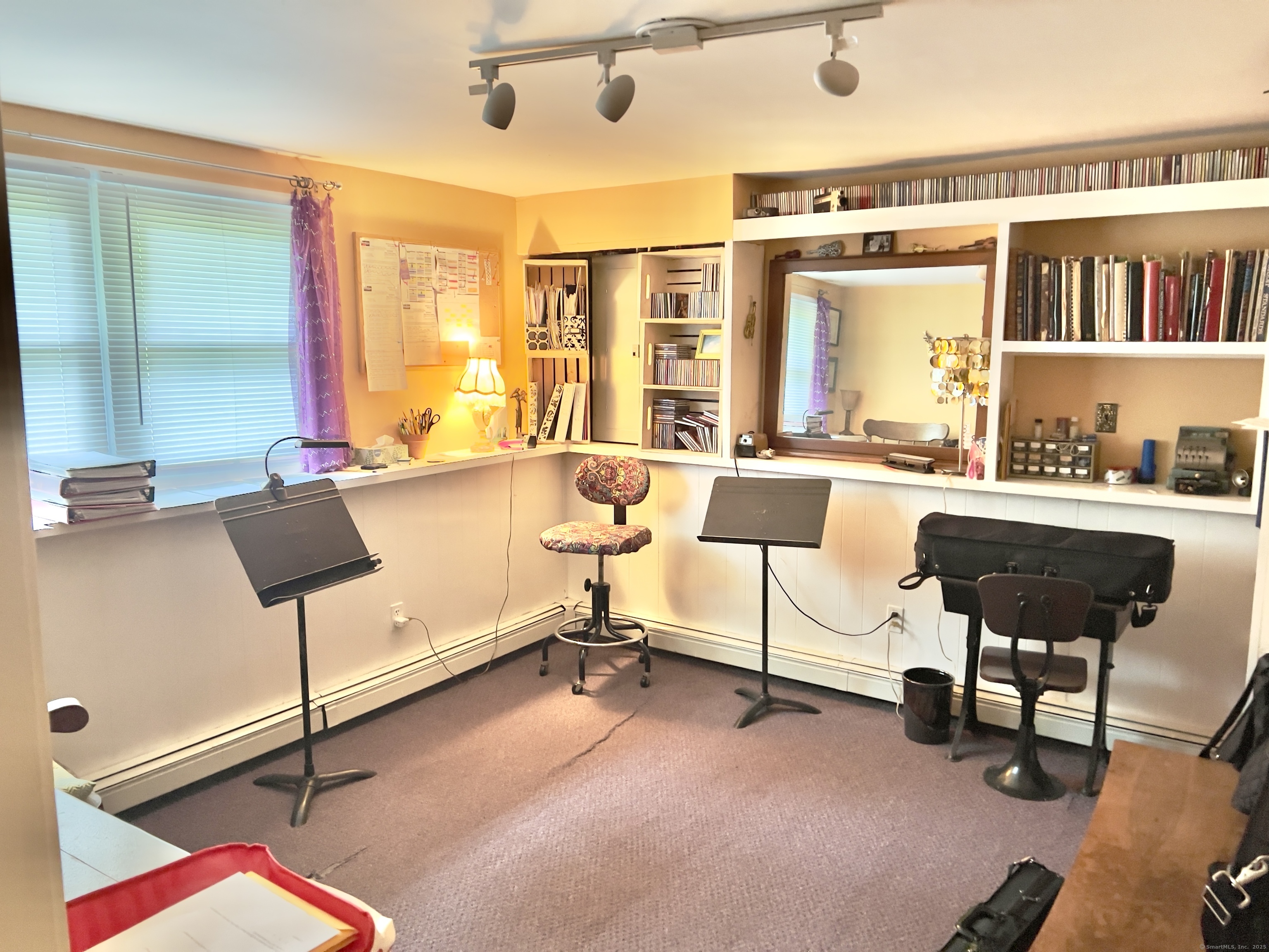 61 Litchfield Road Farmington, CT 06085 - Photo 21 of 27 a living room with furniture a flat screen tv and a table