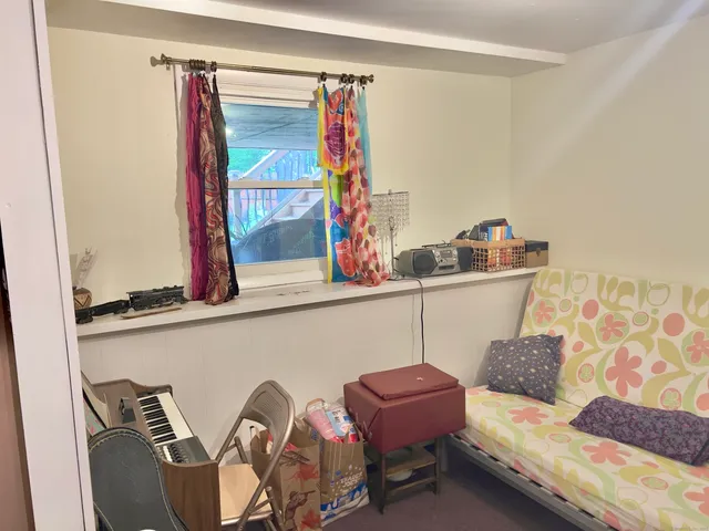 a room with furniture and a flat screen tv