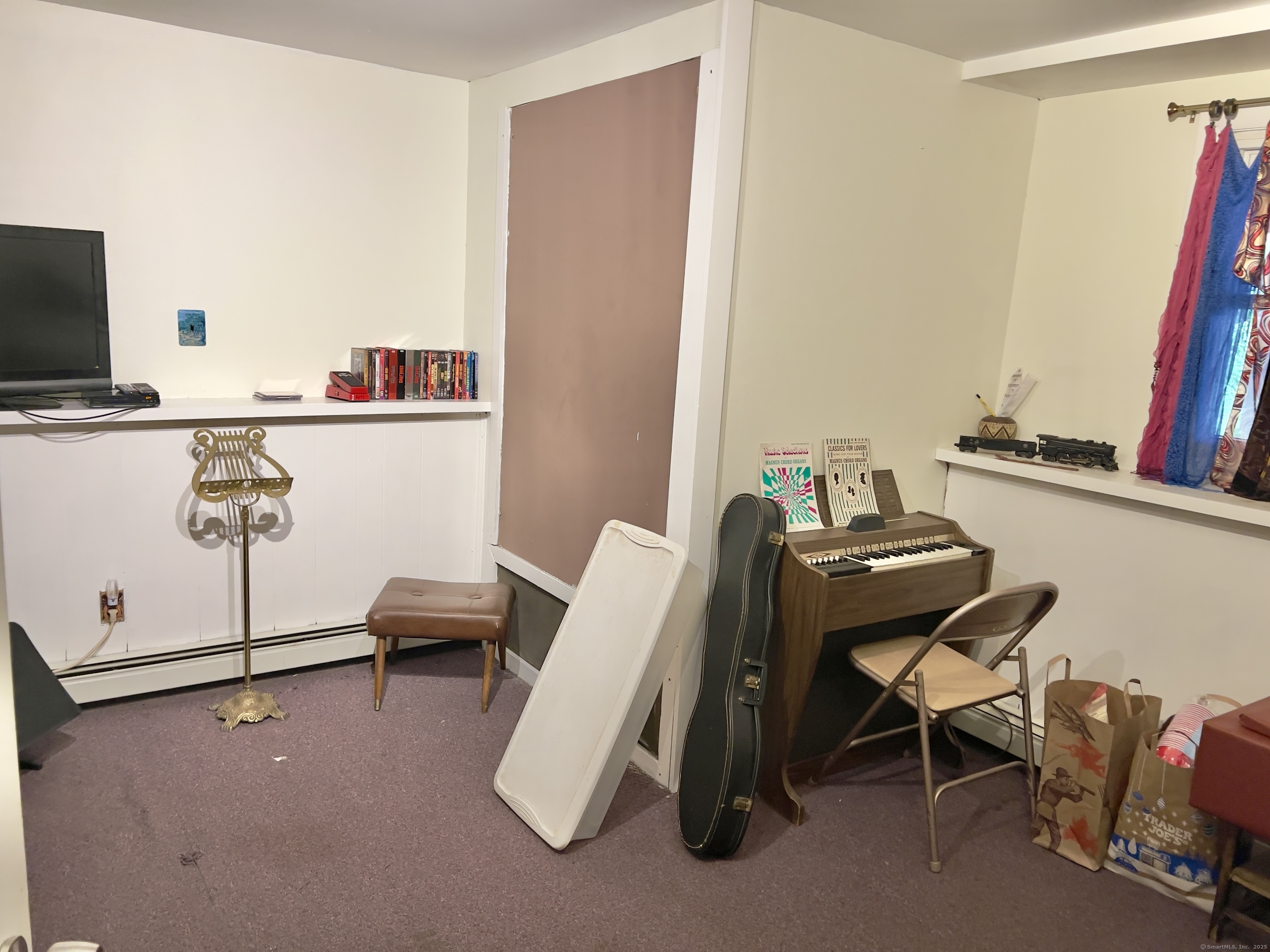 61 Litchfield Road Farmington, CT 06085 - Photo 23 of 27 a room with furniture and a flat screen tv