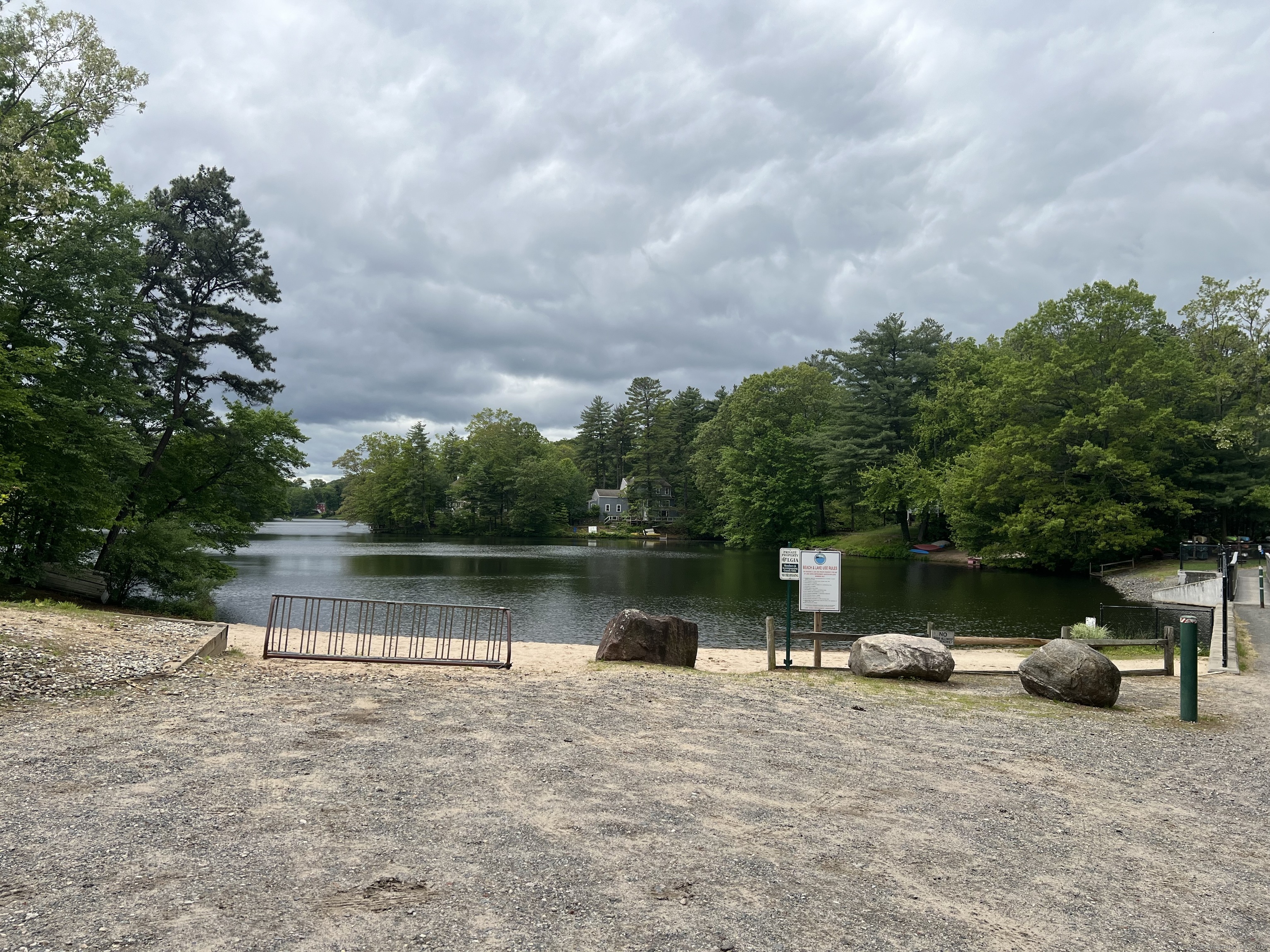 61 Litchfield Road Farmington, CT 06085 - Photo 26 of 27 a lake view with a bench in front of it