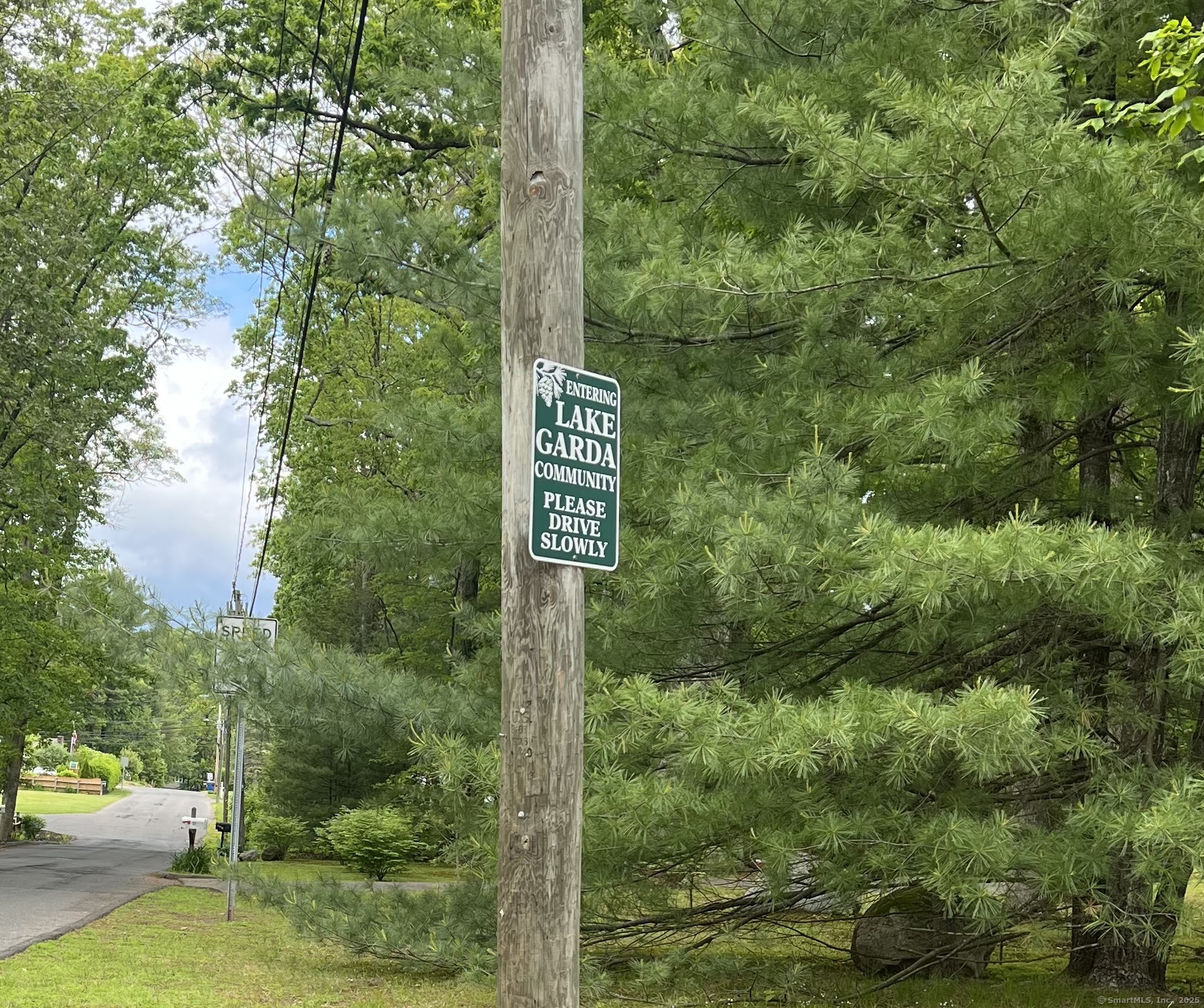 61 Litchfield Road Farmington, CT 06085 - Photo 27 of 27 a view of a street sign next to a road