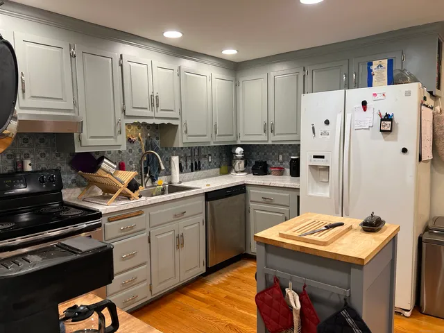 a kitchen with a stove and a sink