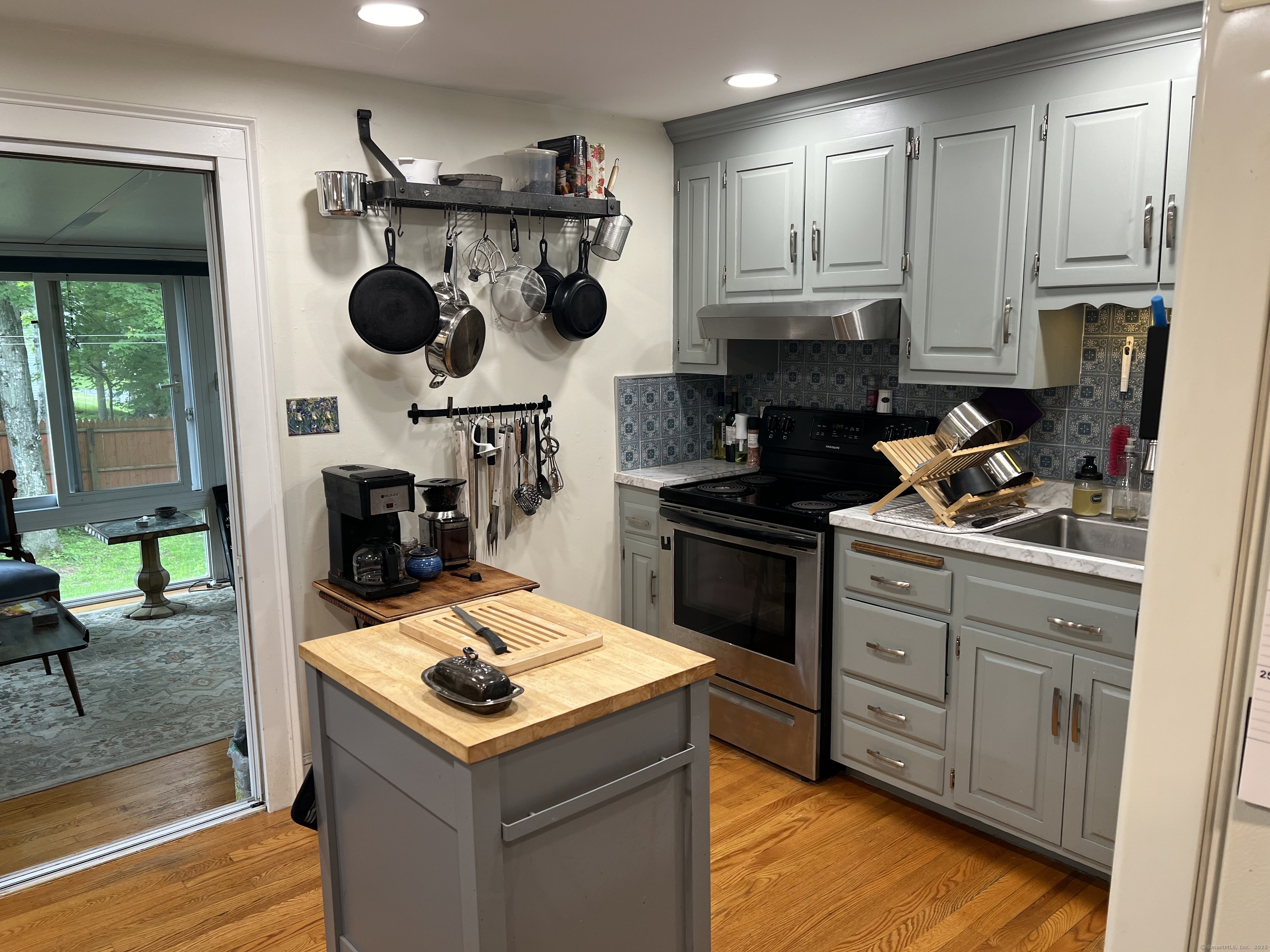 61 Litchfield Road Farmington, CT 06085 - Photo 7 of 27 a kitchen with a stove and a sink