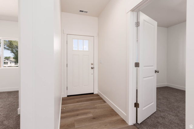51 West 500 South Monroe, UT 84754 - Photo 5 of 41 Entryway featuring a white door with window panes, wood-finish flooring, and white baseboards