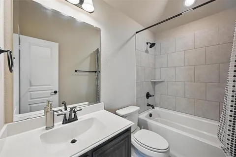 a bathroom with a sink toilet a bathtub and shower