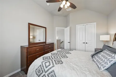 a bedroom with a bed and a dresser