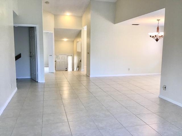 5621 Coach House Circle Boca Raton, FL 33486 - Photo 9 of 26 NEUTRAL TILE IN LIVING AREAS