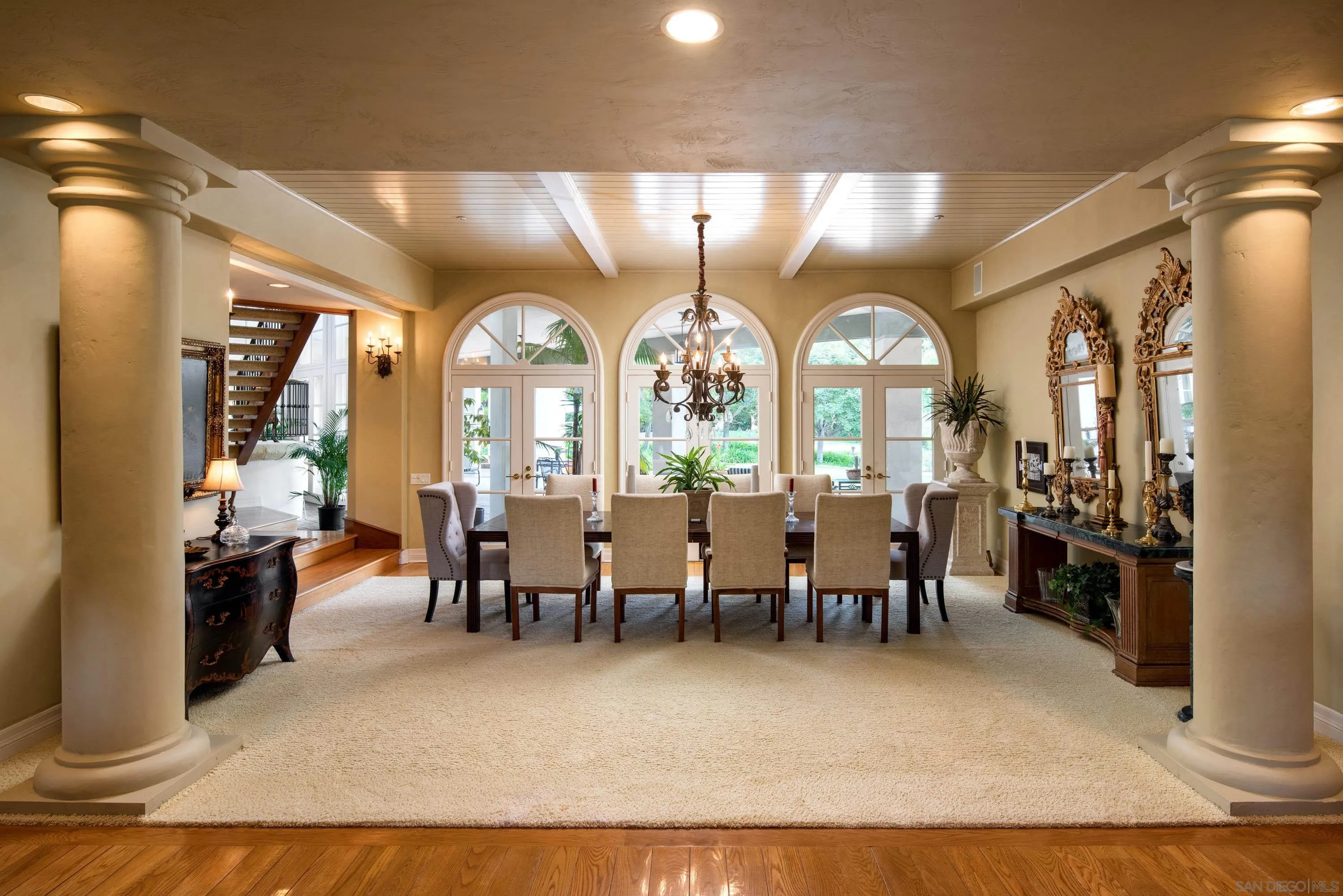 18279 Via De Sueno Rancho Santa Fe, CA 92091 - Photo 11 of 53 a view of a dining room with furniture a chandelier and wooden floor