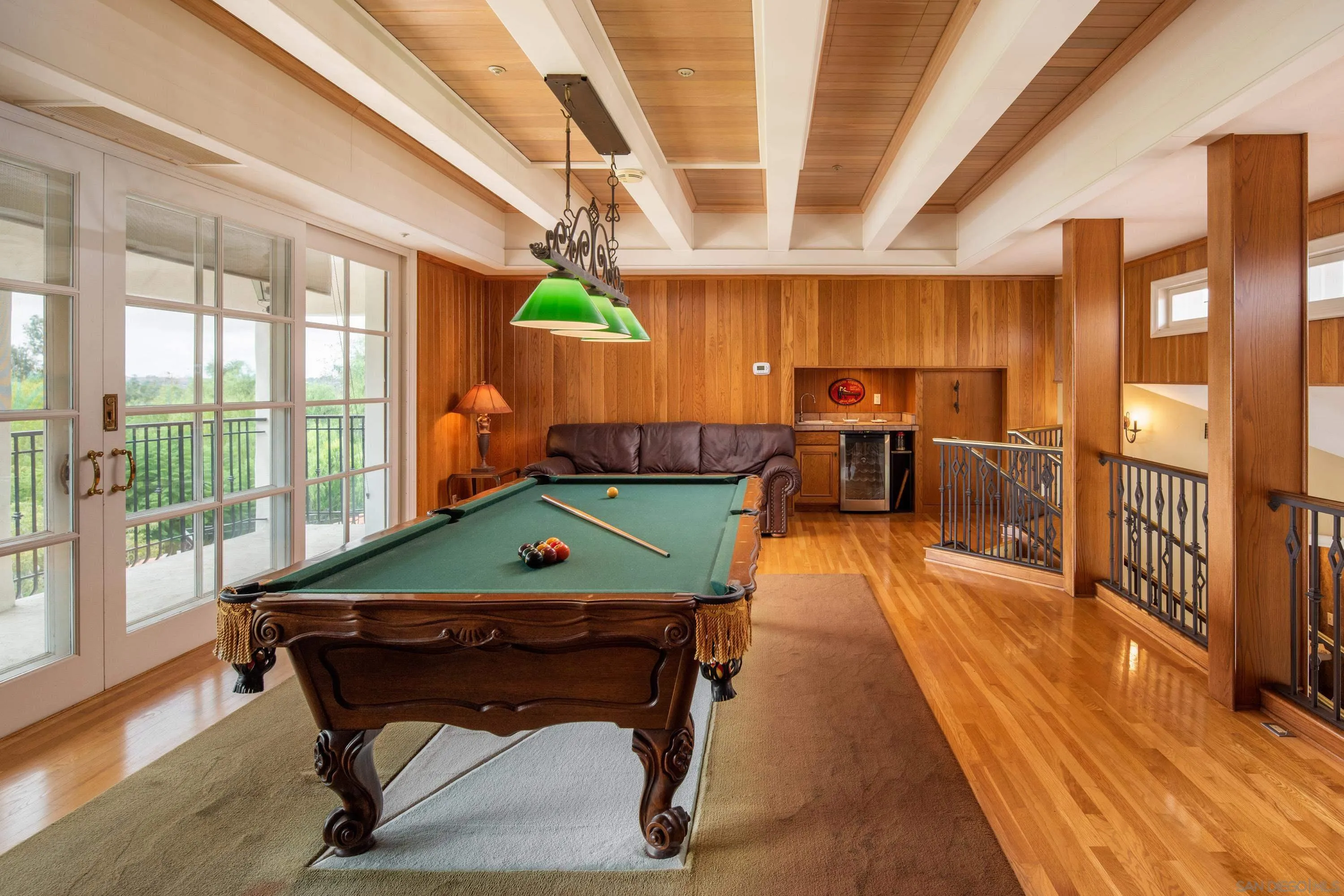 18279 Via De Sueno Rancho Santa Fe, CA 92091 - Photo 15 of 53 a room with furniture pool table wooden floor and windows