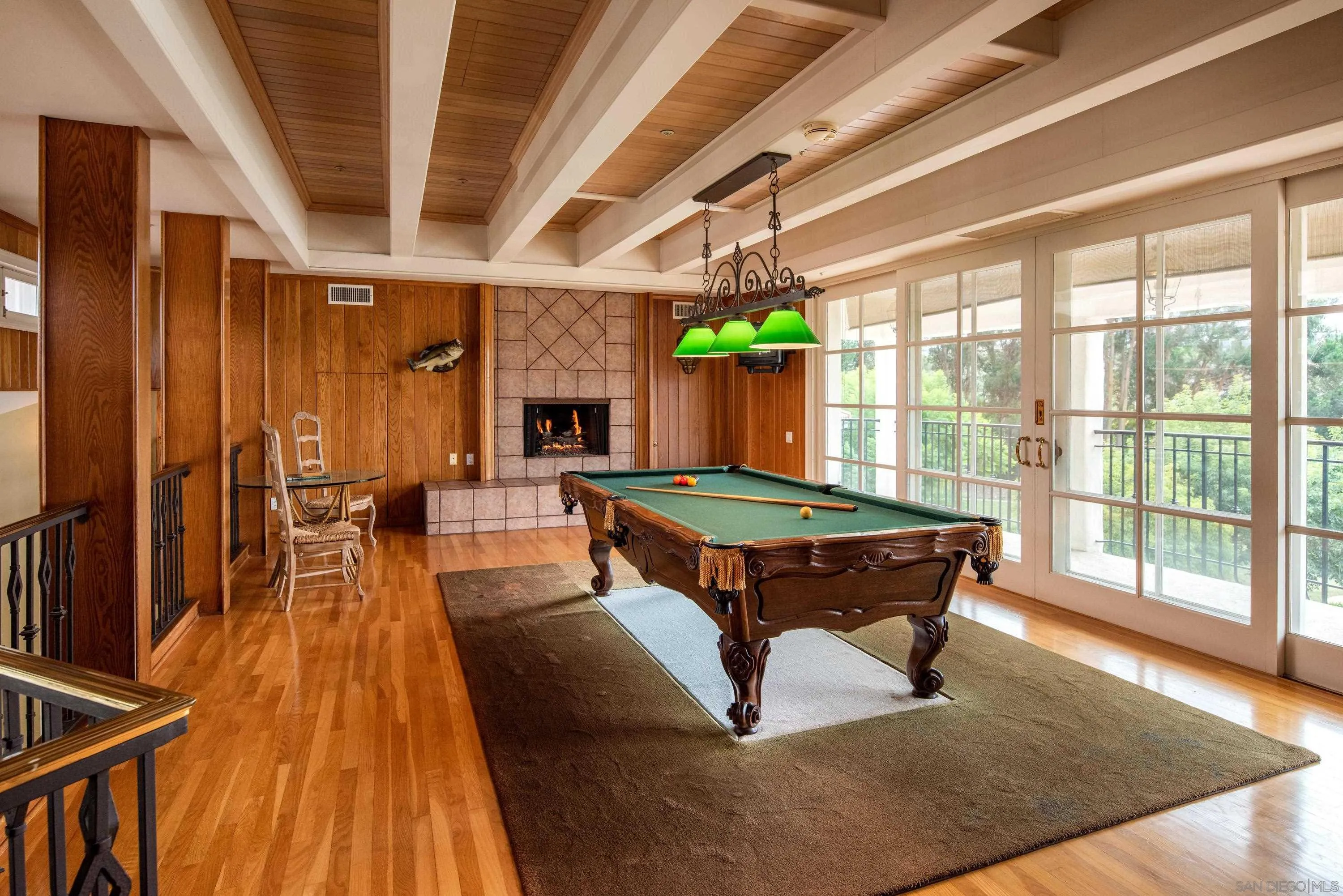 18279 Via De Sueno Rancho Santa Fe, CA 92091 - Photo 16 of 53 a living room with furniture a table and wooden floor