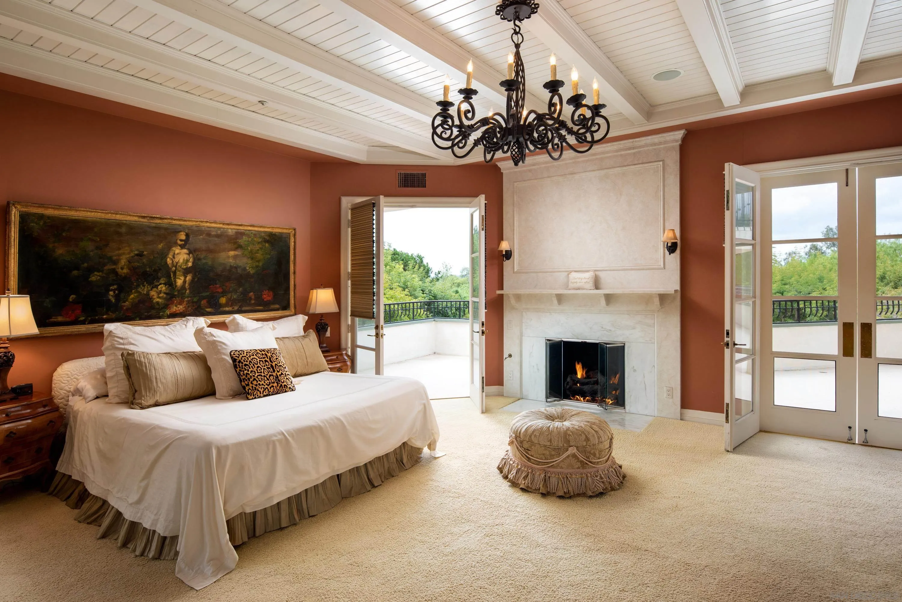 18279 Via De Sueno Rancho Santa Fe, CA 92091 - Photo 18 of 53 a spacious bedroom with a bed and a fireplace