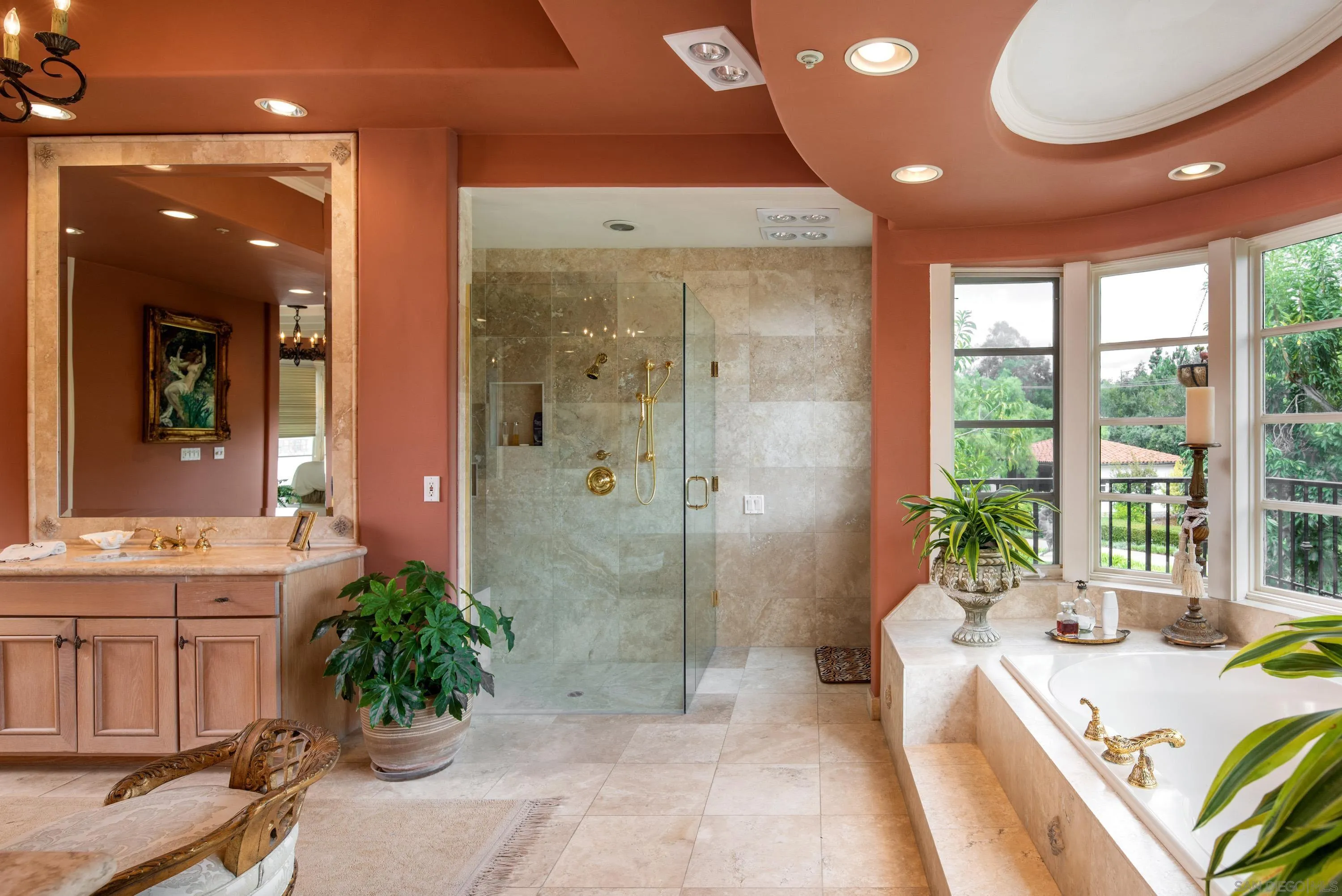 18279 Via De Sueno Rancho Santa Fe, CA 92091 - Photo 20 of 53 a spacious bathroom with a granite countertop tub a mirror and shower