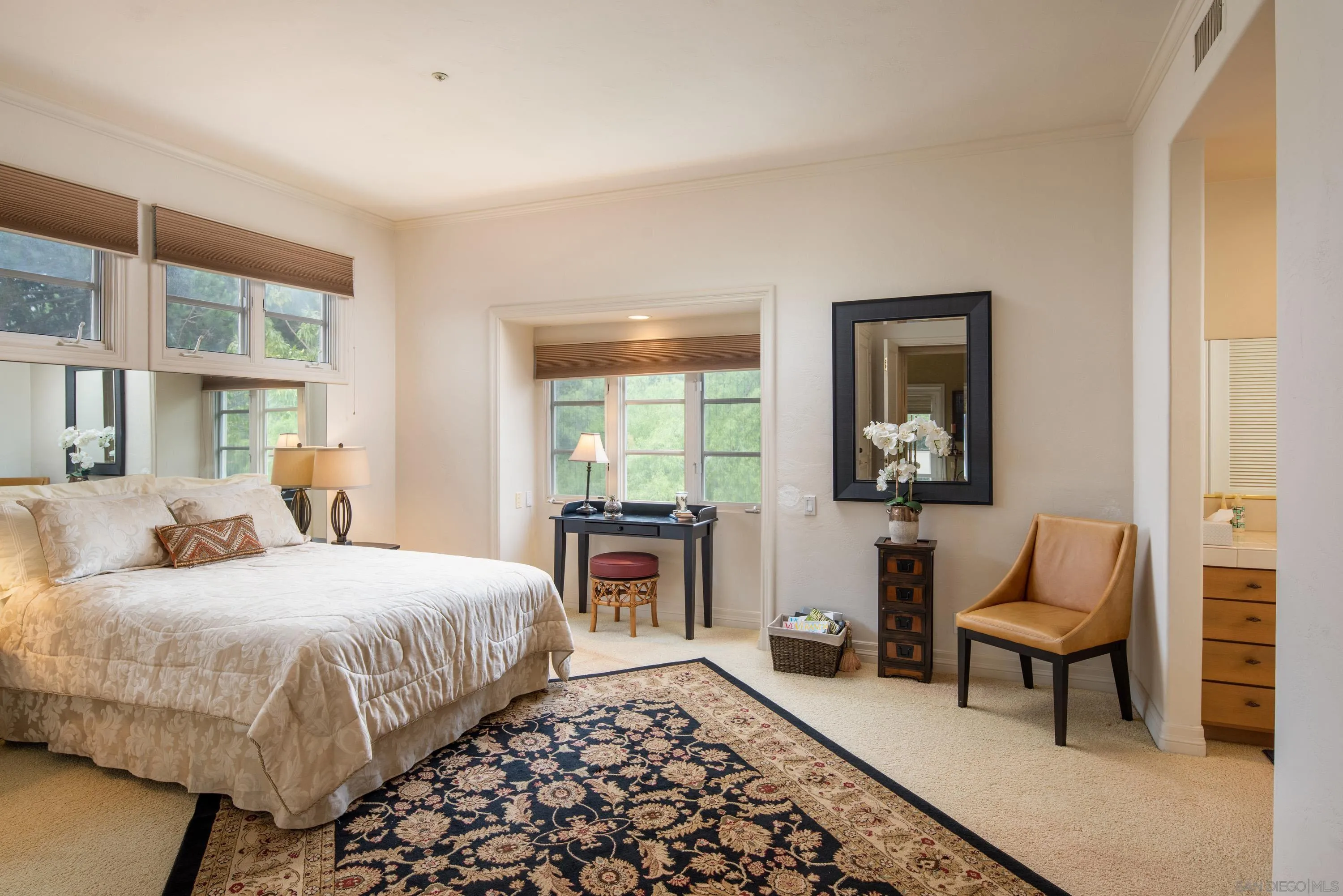 18279 Via De Sueno Rancho Santa Fe, CA 92091 - Photo 24 of 53 a bedroom with a bed and wooden floor