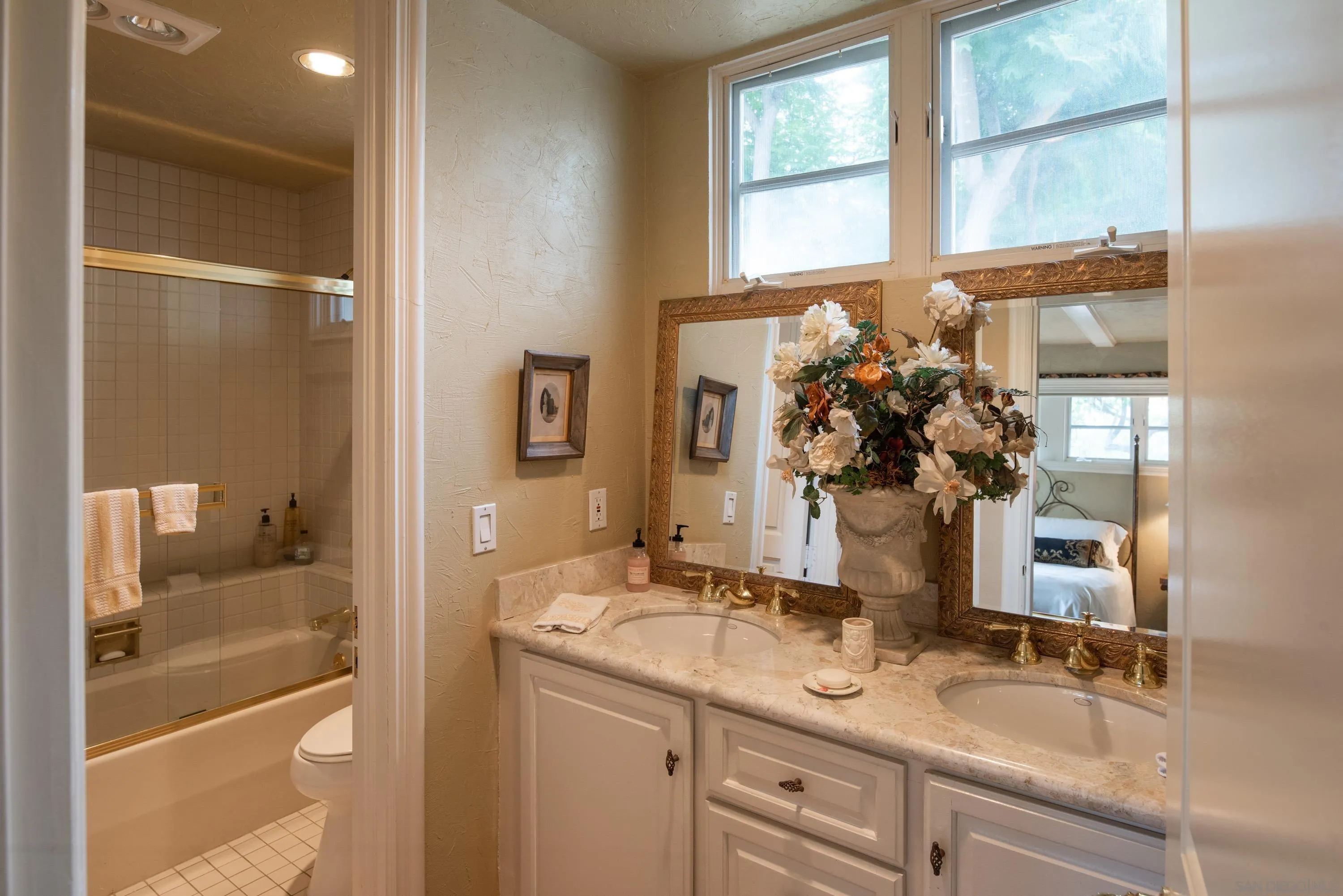 18279 Via De Sueno Rancho Santa Fe, CA 92091 - Photo 26 of 53 a bathroom with a granite countertop sink and a mirror