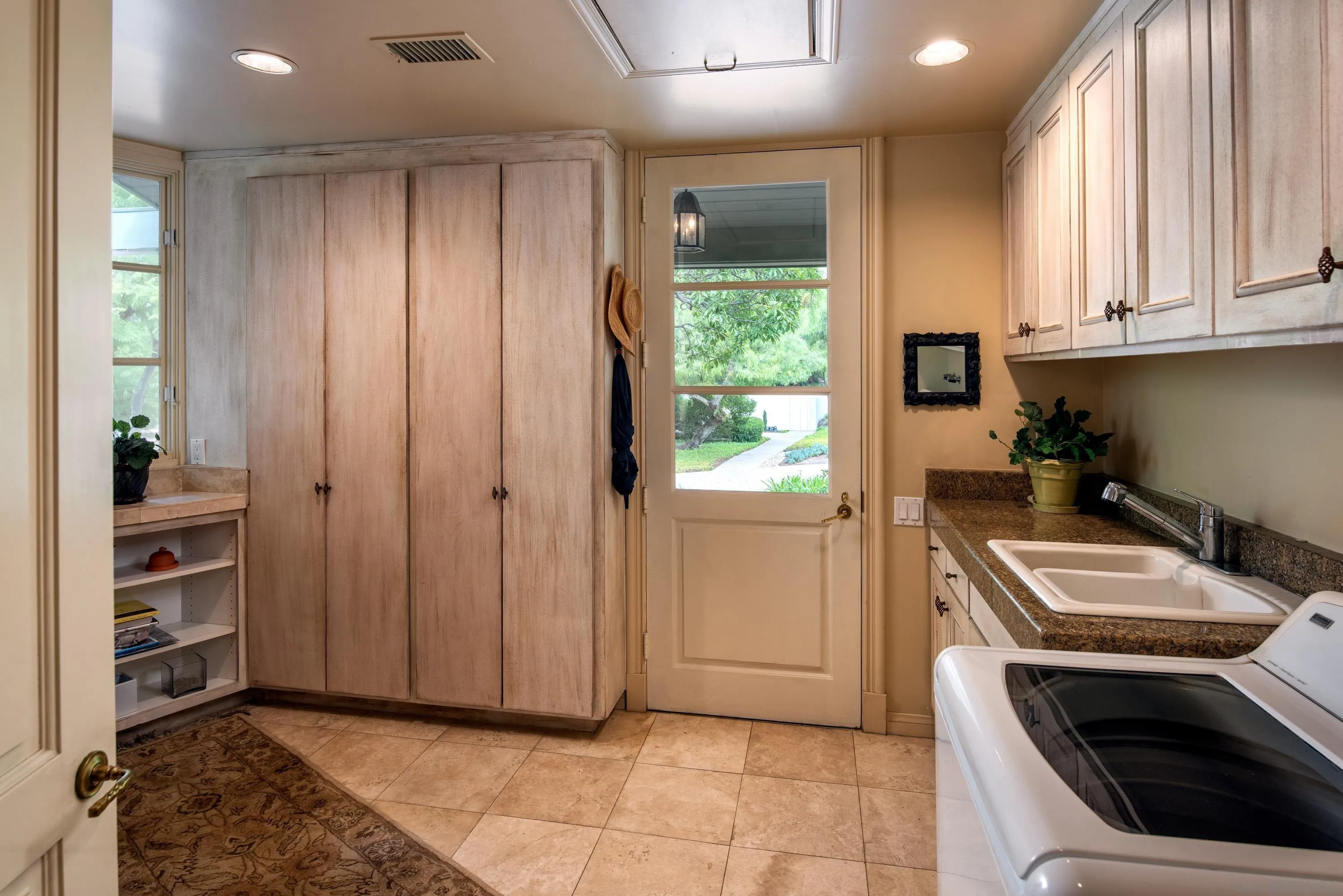 18279 Via De Sueno Rancho Santa Fe, CA 92091 - Photo 27 of 53 a kitchen with a stove and a sink
