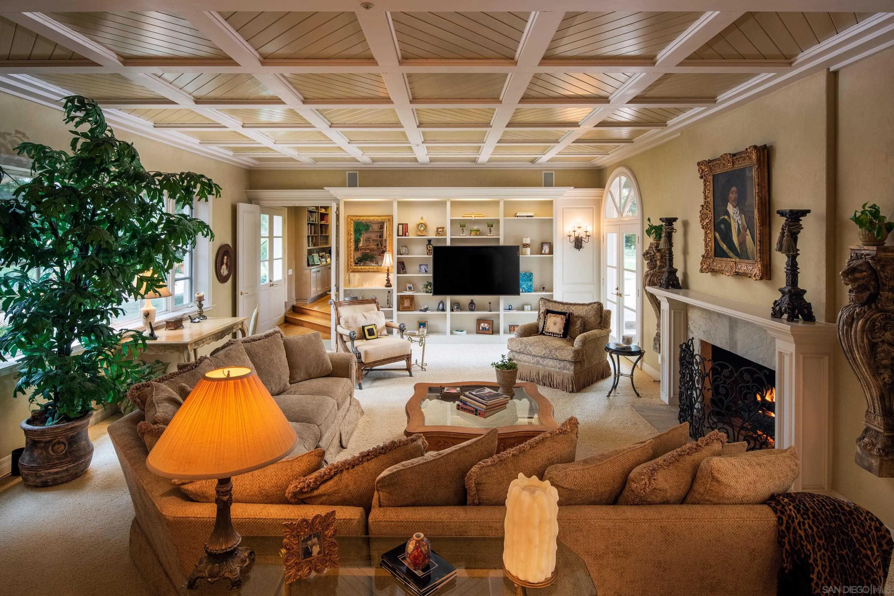 18279 Via De Sueno Rancho Santa Fe, CA 92091 - Photo 28 of 53 a living room with furniture fireplace and a flat screen tv