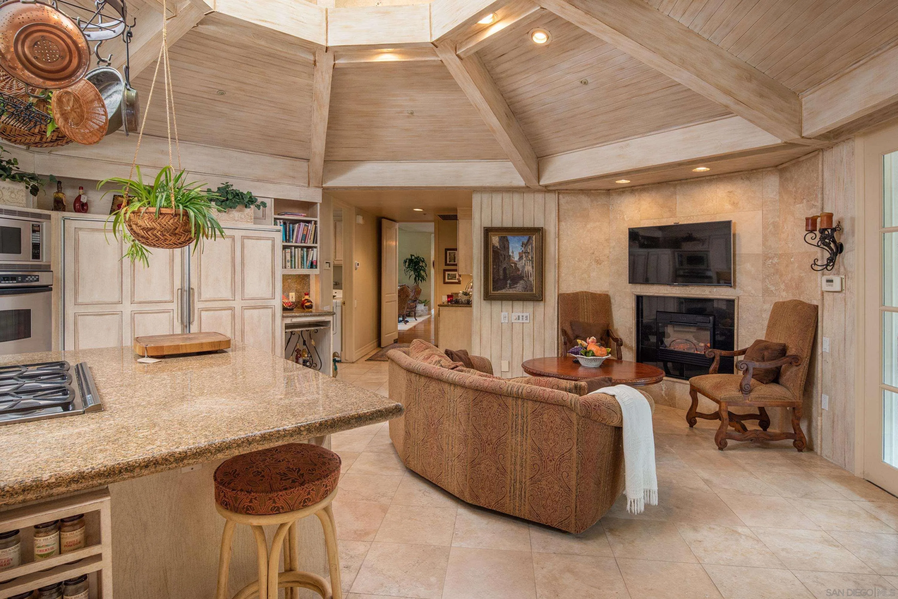 18279 Via De Sueno Rancho Santa Fe, CA 92091 - Photo 29 of 53 a living room with furniture and a fireplace