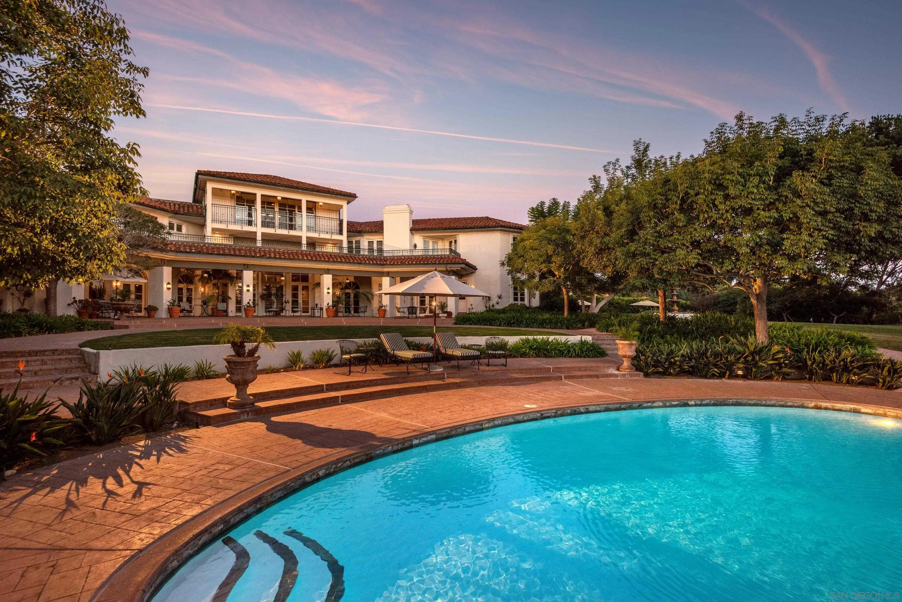 18279 Via De Sueno Rancho Santa Fe, CA 92091 - Photo 32 of 53 a view of a swimming pool with lawn chairs and a yard