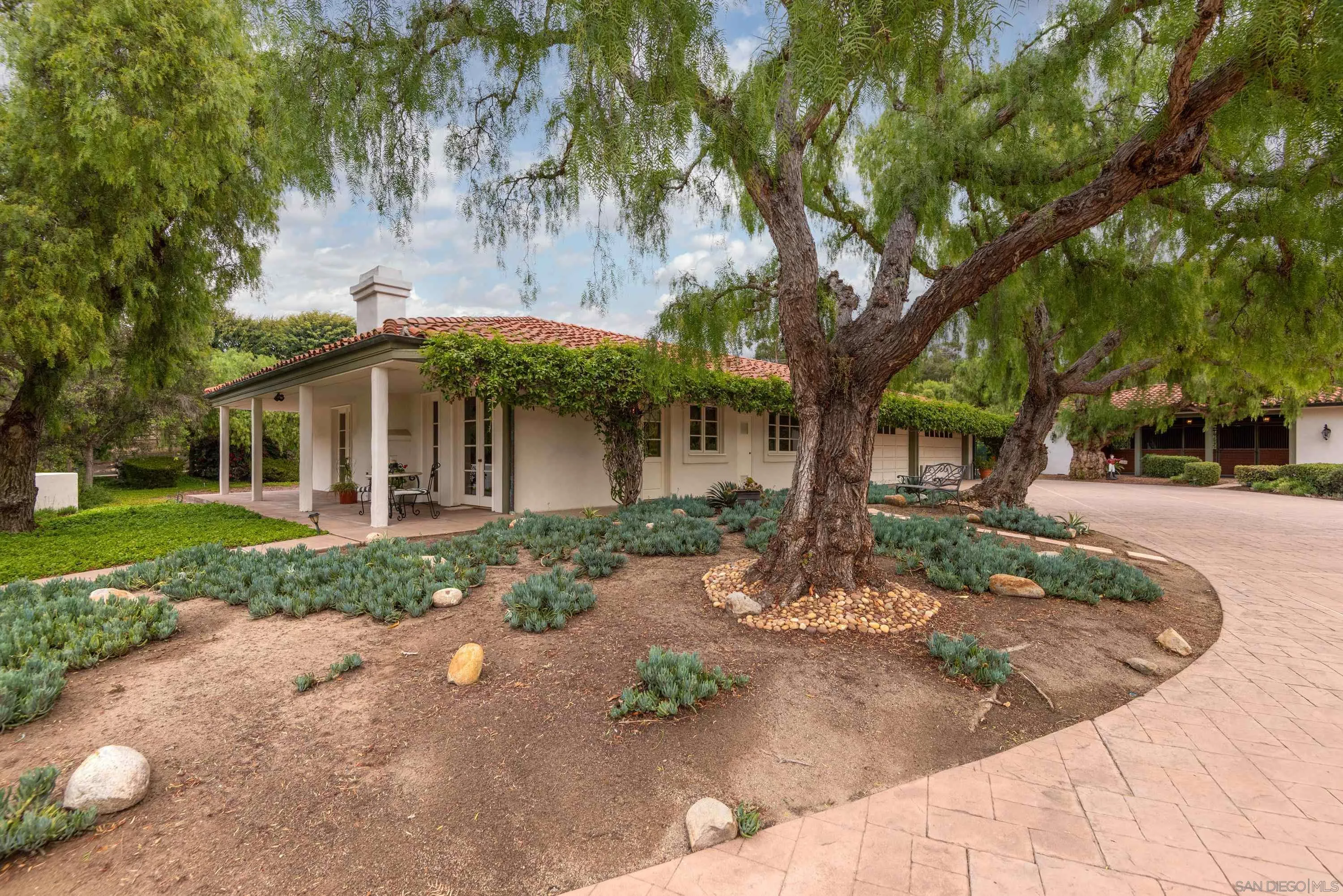 18279 Via De Sueno Rancho Santa Fe, CA 92091 - Photo 37 of 53 a front view of a house with garden