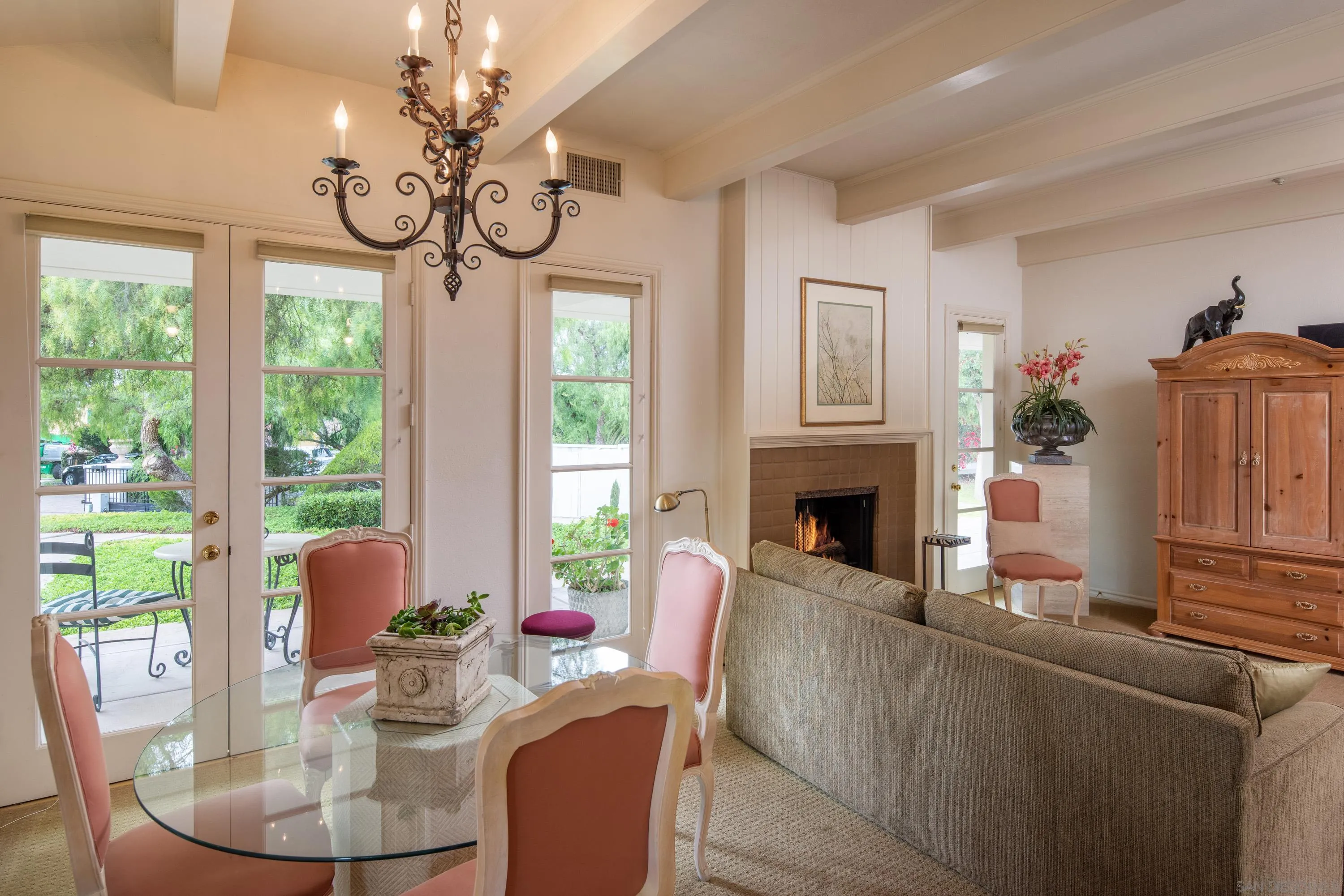 18279 Via De Sueno Rancho Santa Fe, CA 92091 - Photo 38 of 53 a living room with furniture a large window and a fireplace