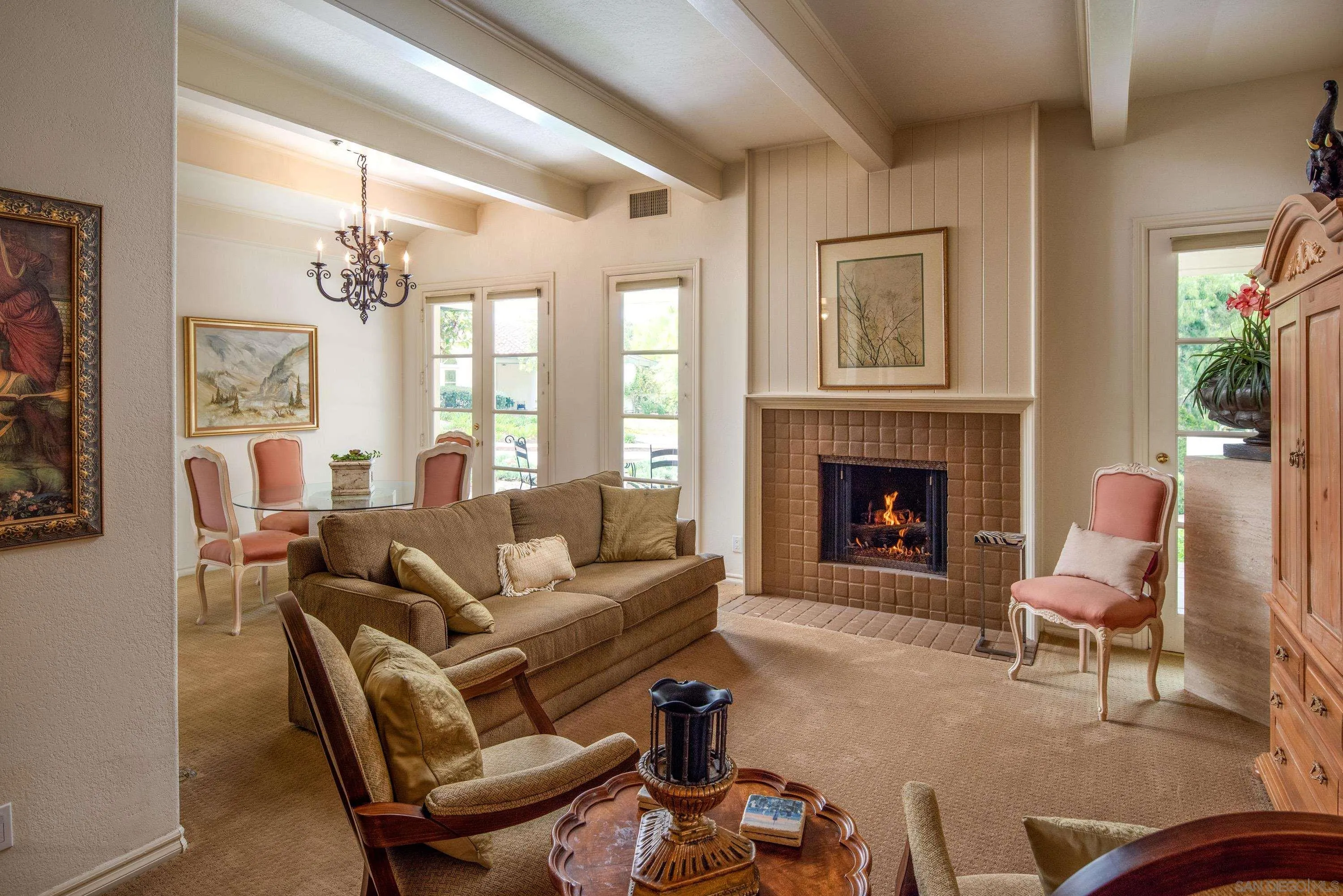 18279 Via De Sueno Rancho Santa Fe, CA 92091 - Photo 39 of 53 a living room with furniture fireplace and a large window