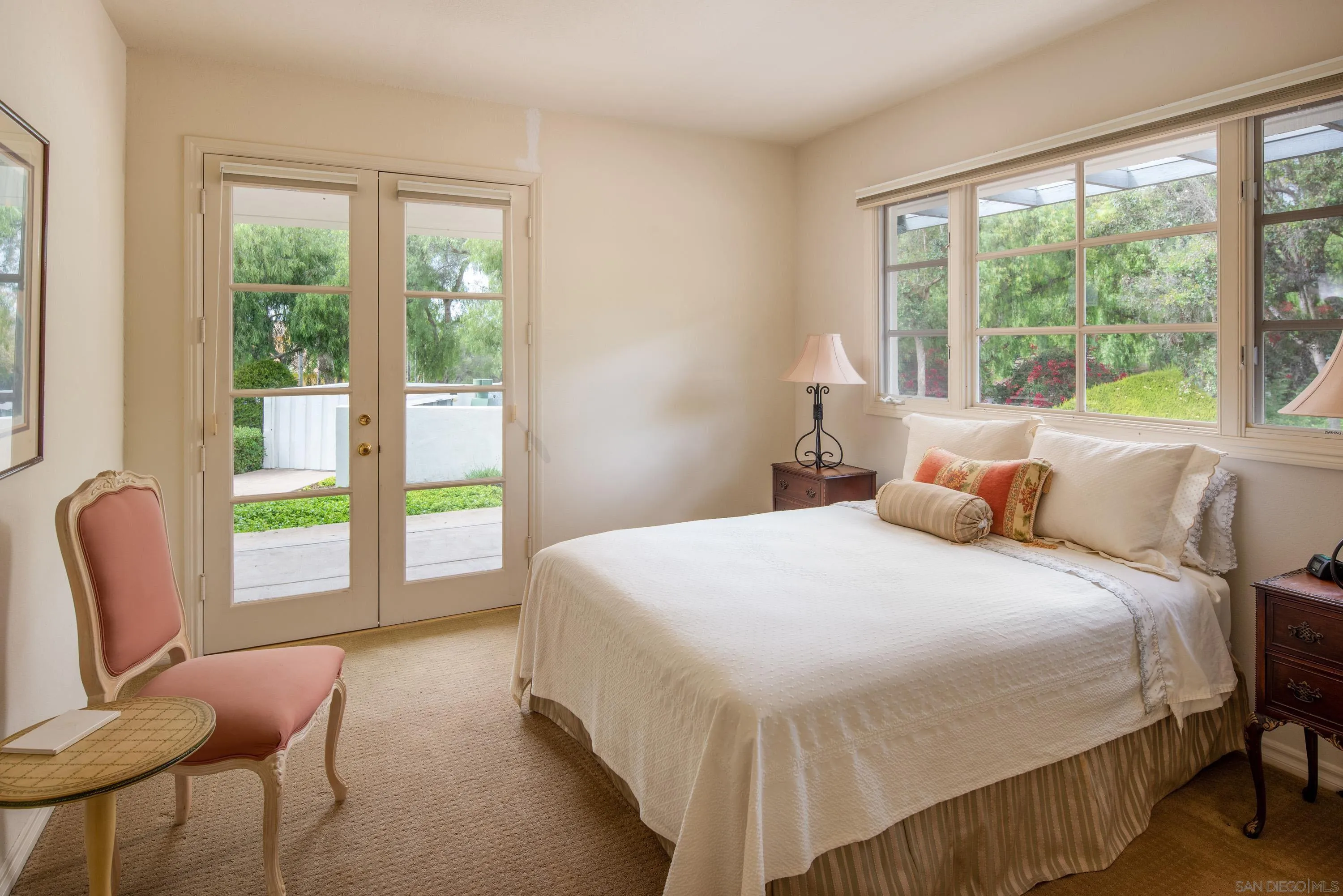18279 Via De Sueno Rancho Santa Fe, CA 92091 - Photo 40 of 53 a bedroom with a bed and a chair with the view of balcony