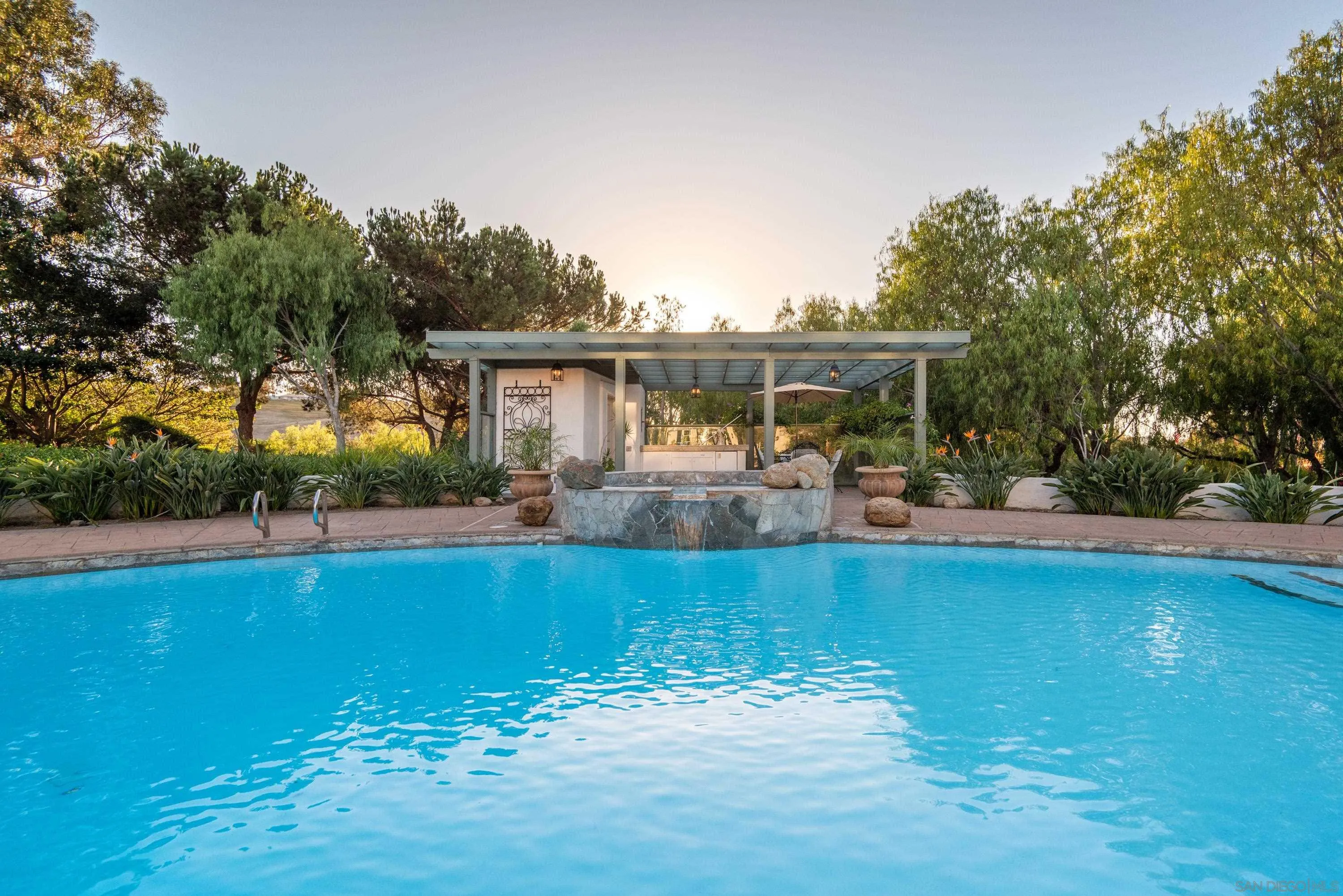 18279 Via De Sueno Rancho Santa Fe, CA 92091 - Photo 4 of 53 a view of a swimming pool with a patio