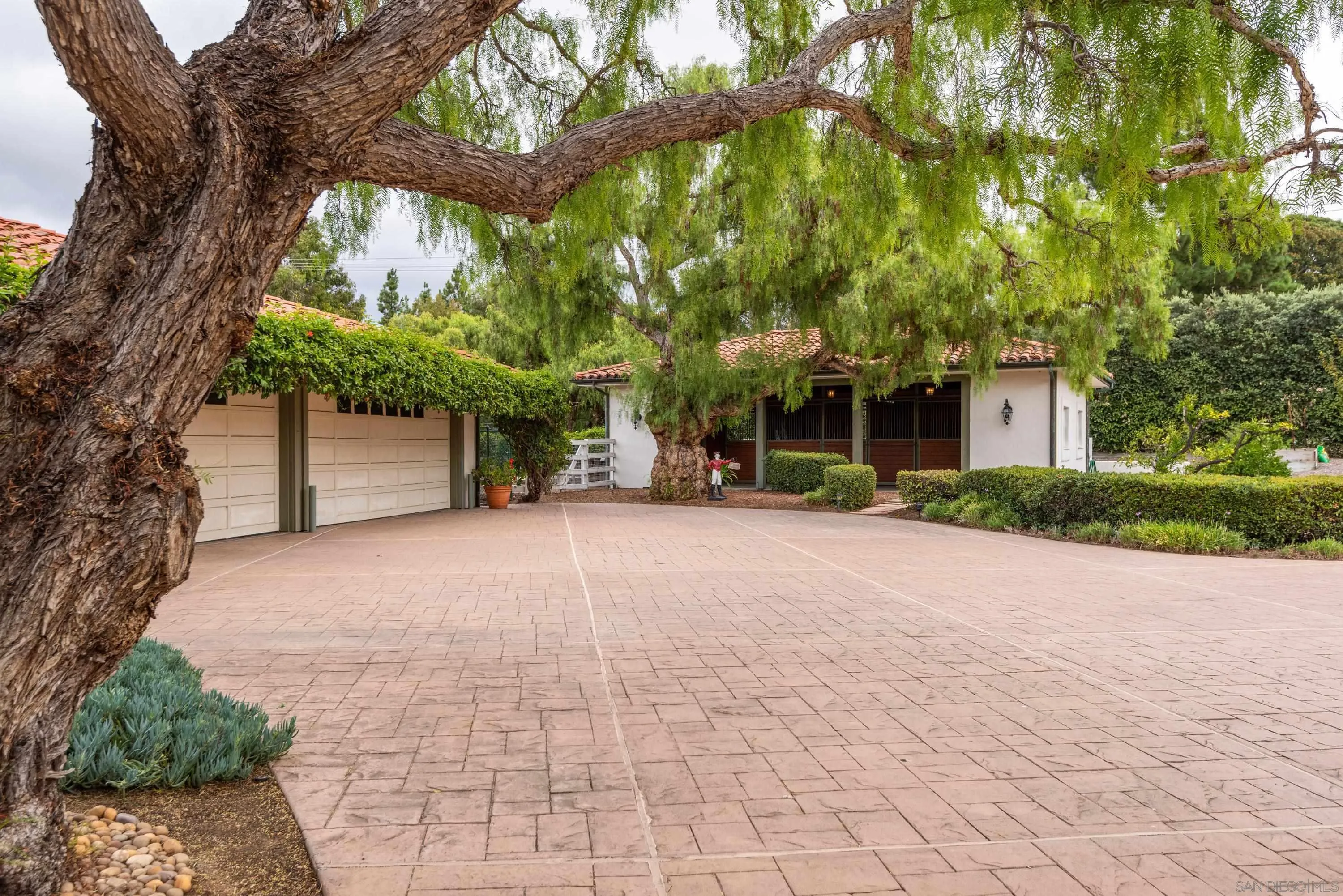 18279 Via De Sueno Rancho Santa Fe, CA 92091 - Photo 41 of 53 a view of a house with a tree and a yard