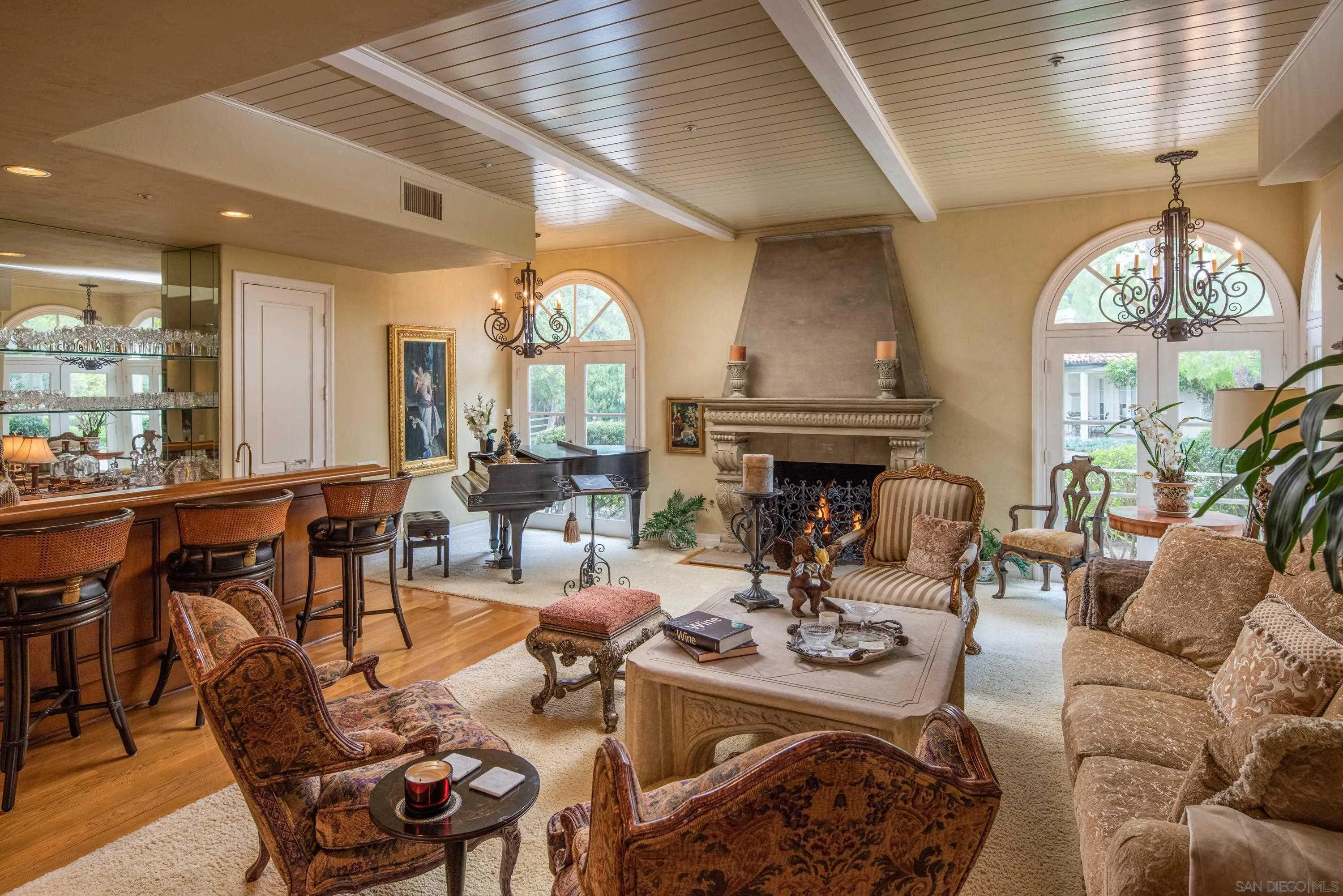 18279 Via De Sueno Rancho Santa Fe, CA 92091 - Photo 10 of 53 a living room with fireplace furniture and a large window