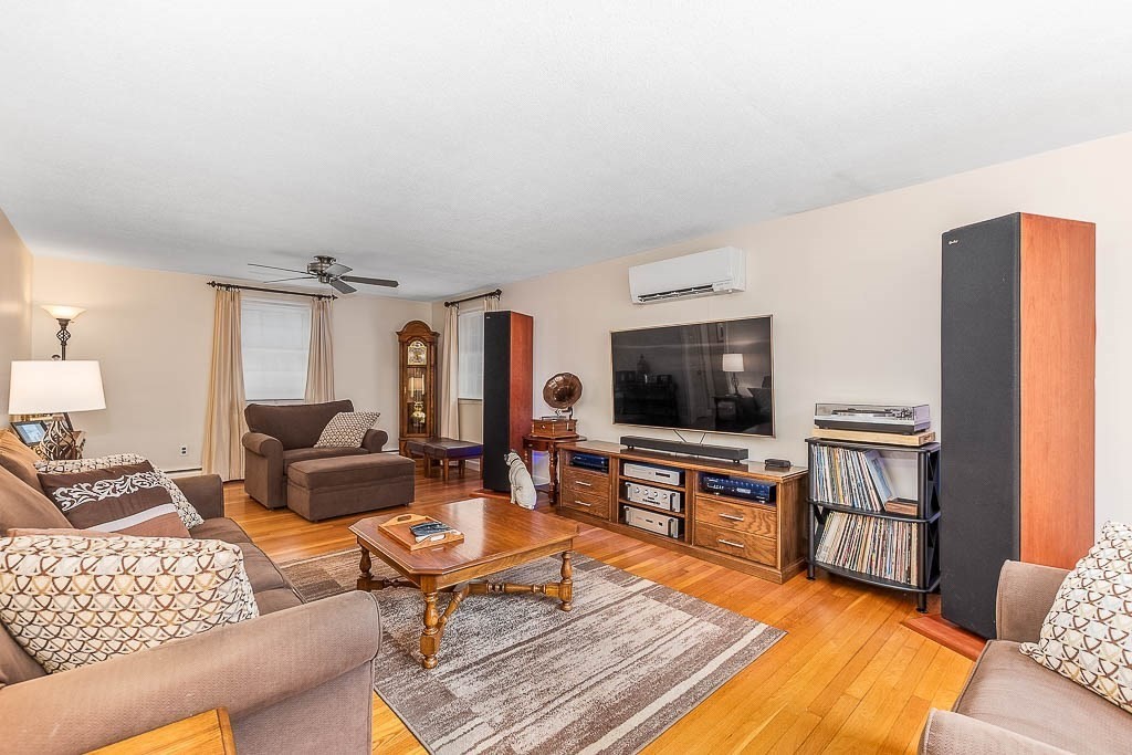 70 Deerfield Road Sharon, MA 02067 - Photo 11 of 29 a living room with furniture and a flat screen tv