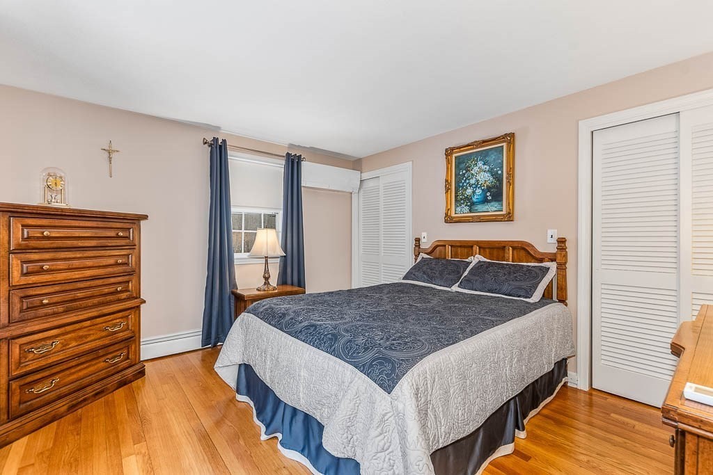 70 Deerfield Road Sharon, MA 02067 - Photo 21 of 29 a bed sitting in a bedroom next to a window
