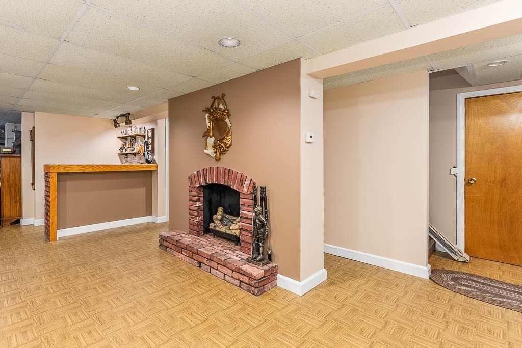 70 Deerfield Road Sharon, MA 02067 - Photo 23 of 29 a living room with a fireplace