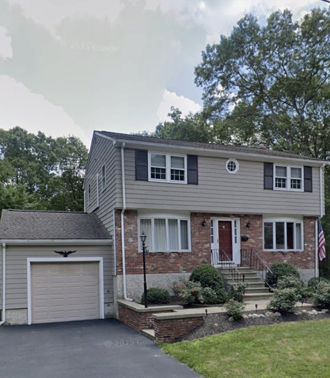 70 Deerfield Road Sharon, MA 02067 - Photo 29 of 29 a front view of a house with a yard
