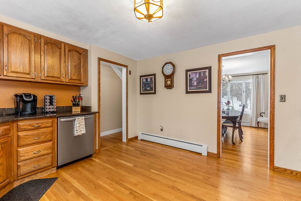 70 Deerfield Road Sharon, MA 02067 - Photo 4 of 29 a kitchen with stainless steel appliances granite countertop a refrigerator and a stove top oven
