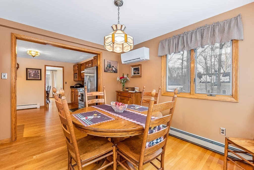 70 Deerfield Road Sharon, MA 02067 - Photo 6 of 29 a view of a dining room with furniture window and wooden floor