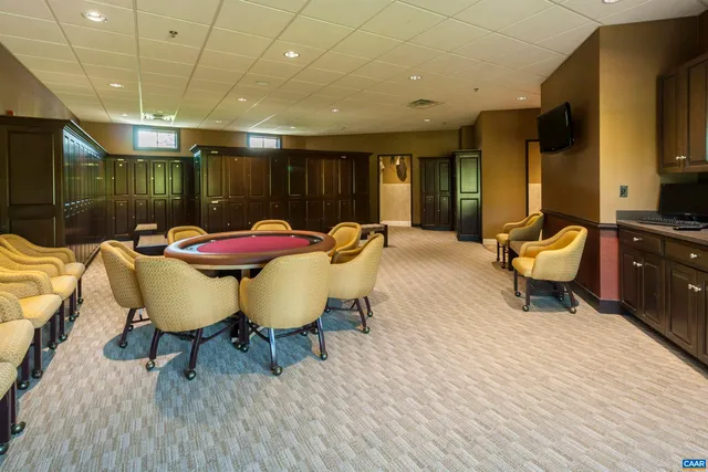 a view of swimming pool with a patio and a garden