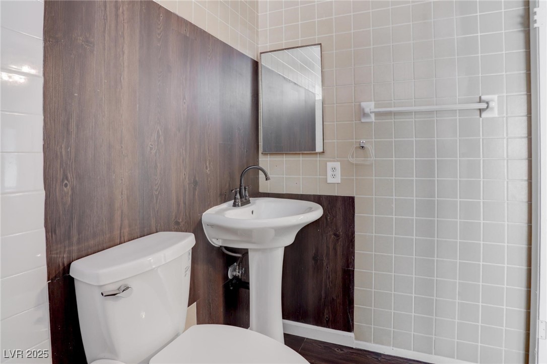 4775 Monaco Road Las Vegas, NV 89121 - Photo 16 of 31 Bathroom featuring tile walls and toilet