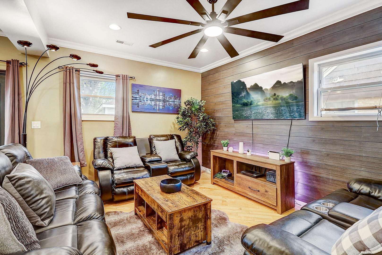 4045 Ruby Street Schiller Park, IL 60176 - Photo 11 of 33 a living room with furniture a flat screen tv and a floor to ceiling window
