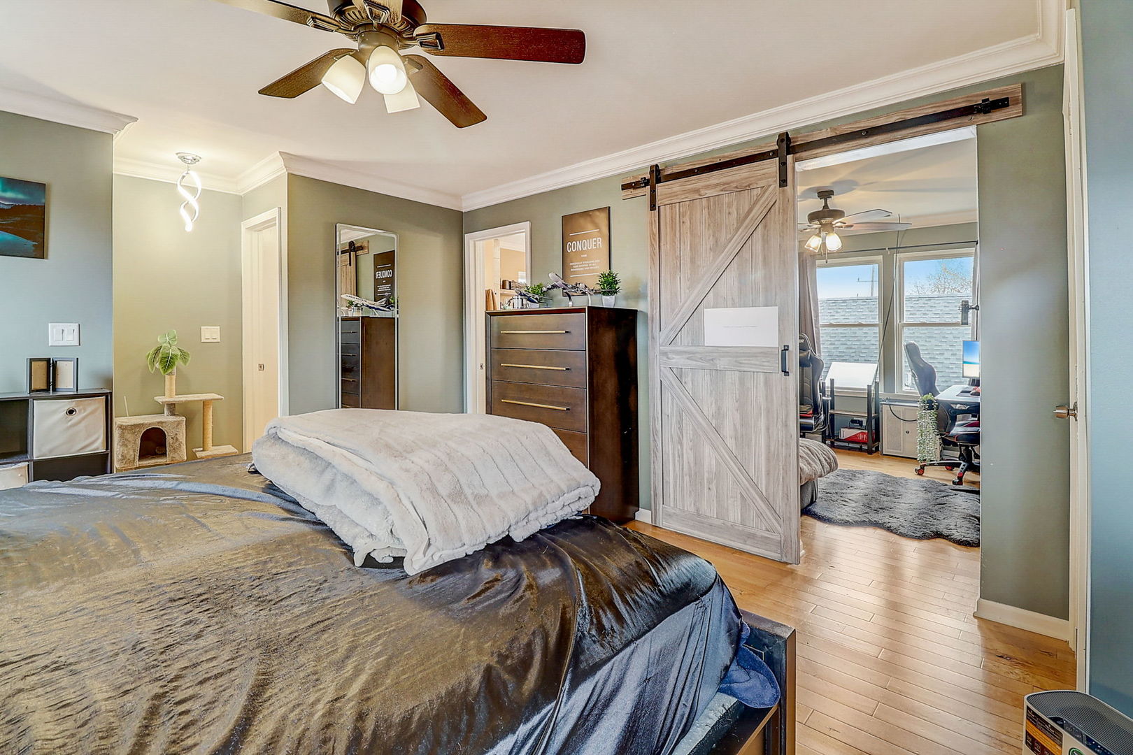 4045 Ruby Street Schiller Park, IL 60176 - Photo 16 of 33 a spacious bedroom with a bed and a chandelier