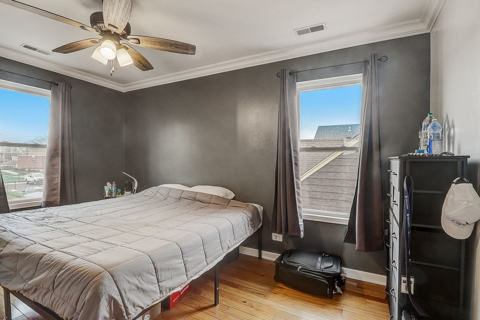 4045 Ruby Street Schiller Park, IL 60176 - Photo 20 of 33 a bedroom with a bed and a chandelier